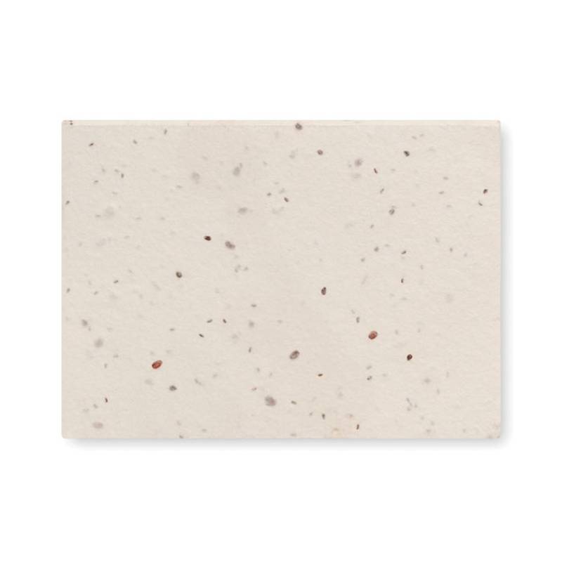 Bloček s lepkami a semenami kvetov ktoré vyrastú po zasadení Bloček s lepkami a semenami kvetov ktoré vyrastú po zasadení