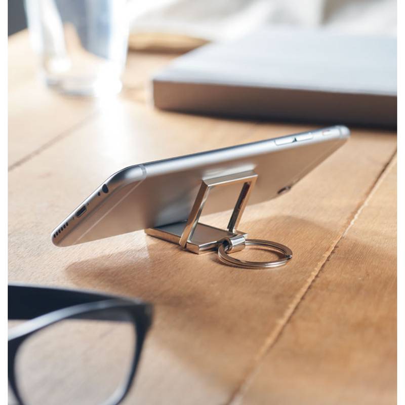 Kľúčenka a stojan na telefón, sivá strieborná Kľúčenka a stojan na telefón, sivá strieborná